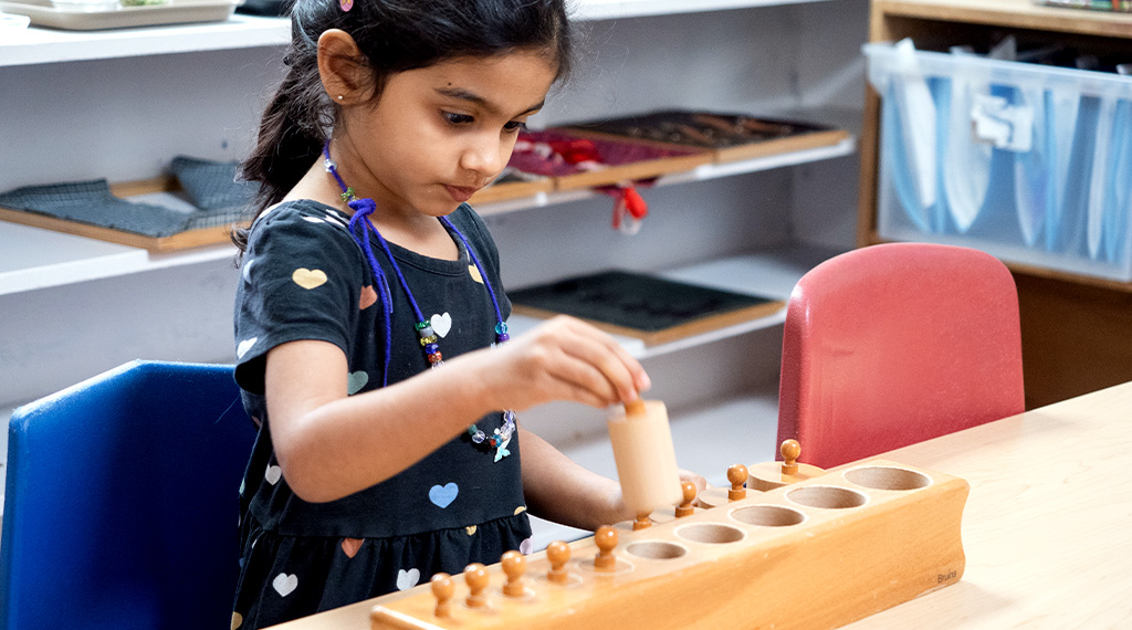 child learning shapes in a montessori preschool