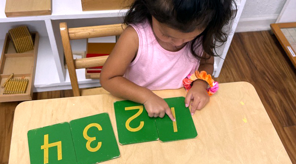 Child learning numbers in a montessori school