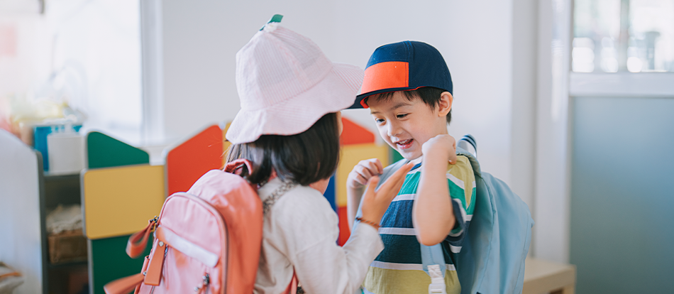 A Montessori preschool student prepares for class