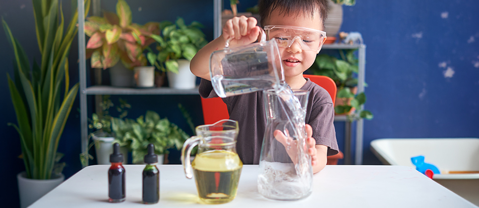 montessori student learning life skills like pouring water