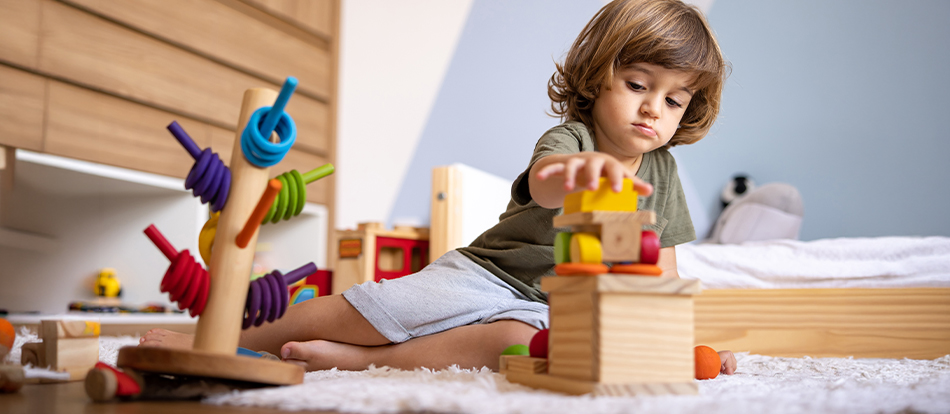 A Montessori student using montessori toys at home