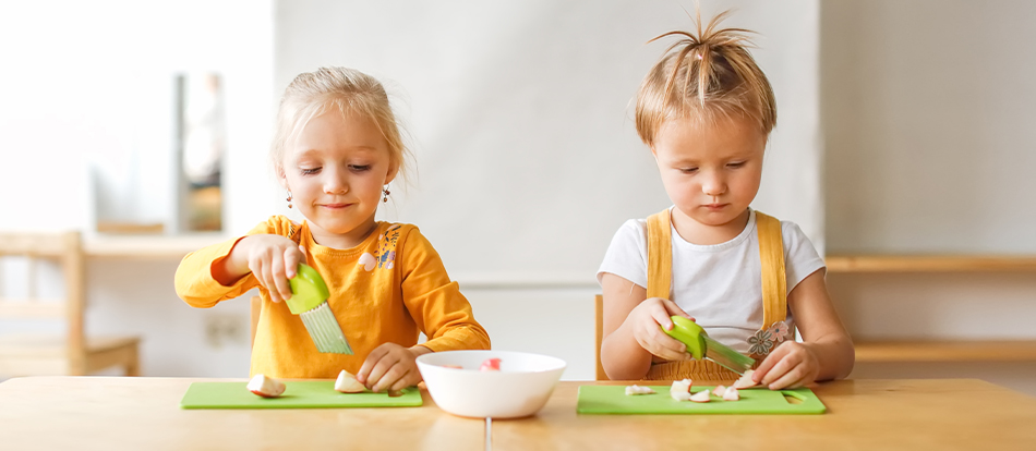 Montessori kids practice chopping vegetables